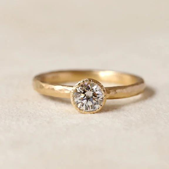 Tapered bezel diamond ring